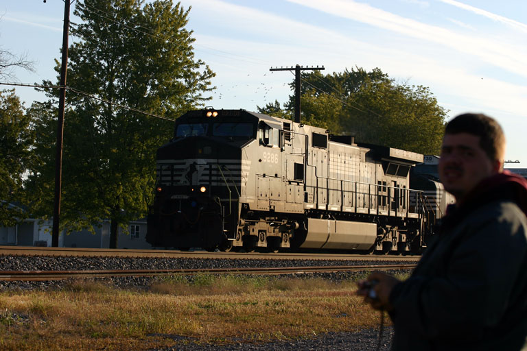 NS 9286
You know, if you are going to get in my shot, would you mind at least looking at the train?  Or maybe you turned cuz you heard me YELLING at you! ahaha.  10/01/05
NS 9286 WESTBOUND 8:41 AM 81 CARS
NS 6730 
