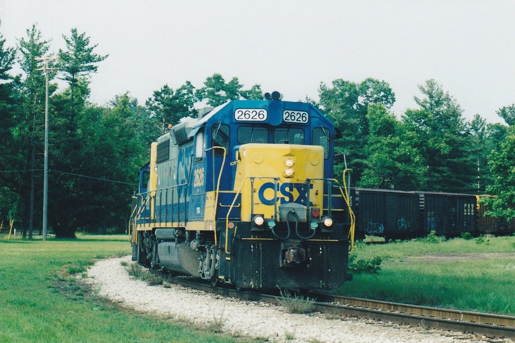 CSX GP38-2 #2626
D704, the Baldwin Turn, is shown southbound at White Cloud, MI on the old wye along M-37 with a short Saturday train for Grand Rapids.  August, 2002.
Keywords: CSX D704 Baldwin Turn White Cloud GP38-2 2626