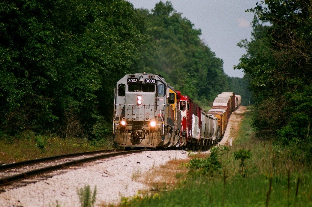 MQT SD40-2 #3003
Marquette Rail's southbound Z151 road freight heads gears up to life this 54 car freight out of the roller coaster cut near Milepost 53.  Leading the train today is the colorful consist of #3003, #2004 and GRE #3839.  July 3, 2013.
Keywords: MQT Marquette Rail SD40-2 3003 2004 3839 hill zoom roller coaster 15 mile road Z151 milepost 53