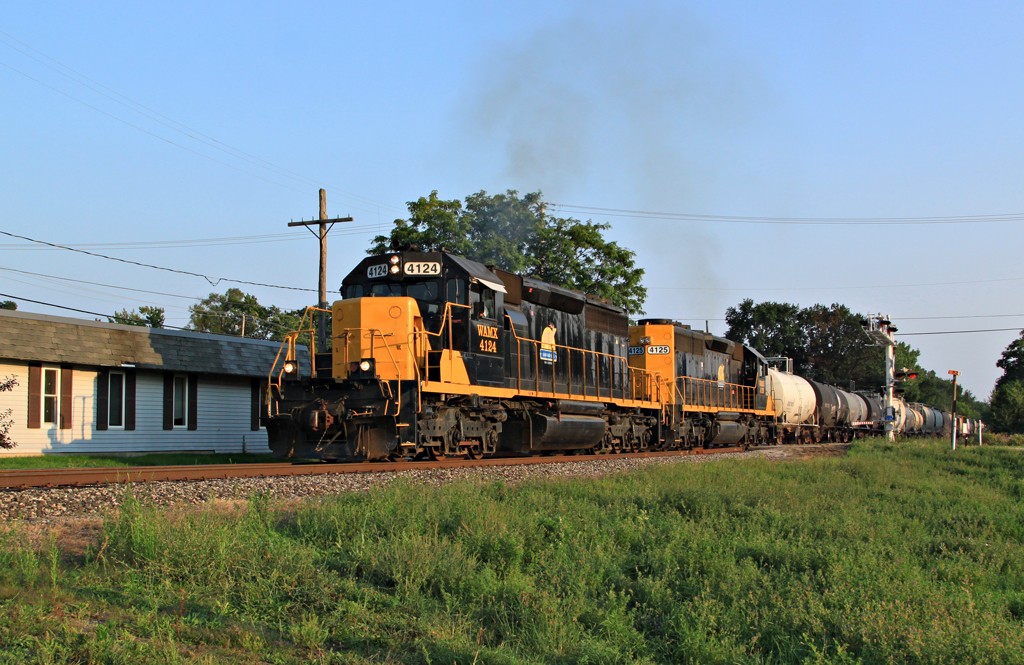 Watco in Wayland
Grand Elk 4124 and 4125 notch out as they start northbound after switching in Wayland in the late evening light. 
Keywords: Wayland Grand Elk Watco