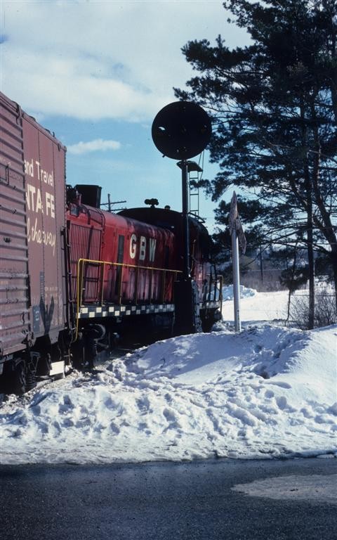 MIGN April 1977 Cadillac
MIGN 301 (GBW) is derailed at Cadillac near the Ann Arbor diamond with a southbound train.

