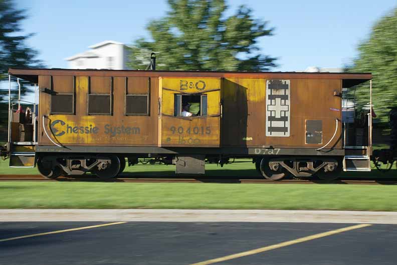 Ex-Chessie System B&O caboose No. 904015 (formely the caboose of discontinued CSX train D727, the Cannonball) brings up the rear of CSX local Y121, the Holland local, as it passes along Freedom Village on CSX's Dock Track in Holland, Michigan on September 27, 2005. Photo by J.R.V. at HS.
