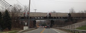 Coal hoppers being pulled into the Eastlake coal power plant in December 5, 2014.  This spur overpass is on Lakeshore Blvd in Eastlake, Ohio.  Notice the timber supports for the overpass.
